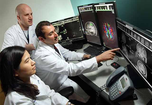 Board-certified radiologist reviewing ultrasound images for accurate diagnostic results